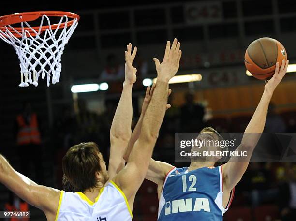 Cibona Zagrep's Luksa Andric drives to the basket as Fenerbahce Ulker's Semih Erden tries to block him during their Euroleague group match at Abdi...