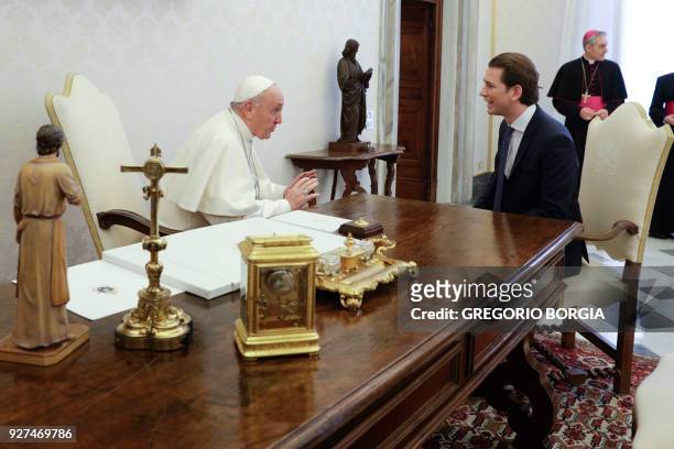 Pope Francis talks with Austrian Chancellor Sebastian Kurz during a private audience at the Vatican on March 5, 2018. / AFP PHOTO / POOL / Gregorio...