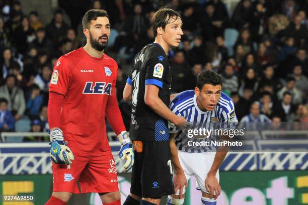 Hector Moreno of Real Sociedad duels for the ball with Pacheco and Guidetti of Alaves during the Spanish league football match between Real Sociedad...