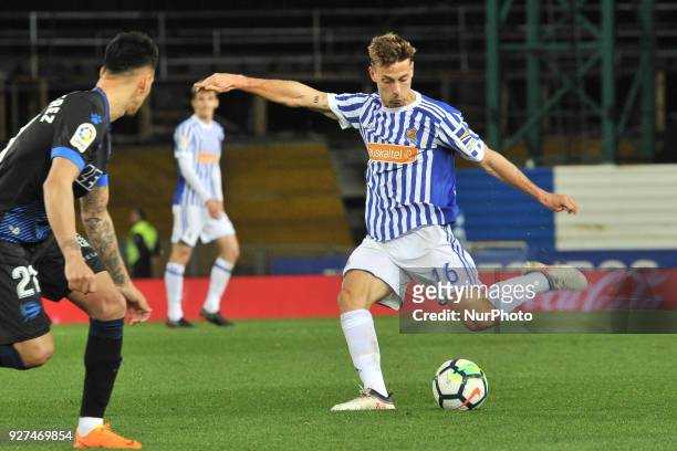 Sergio Canales of Real Sociedad duels for the ball with Hernan Perez of Alaves during the Spanish league football match between Real Sociedad and...
