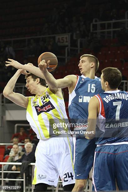 Omer Asik, #24 of Fenerbahce Ulker competes with Tomislav Zubcic, #15 of Cibona and Bojan Bogdanovic, #7 of Cibona during the Euroleague Basketball...