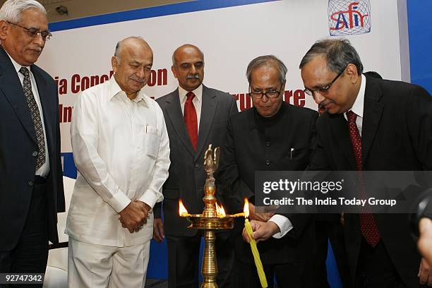 Finance Minister Pranab Mukherjee innaugurates and lights the lamp along with Chief Minister of Maharashtra, Sushilkumar Shinde in New Delhi.