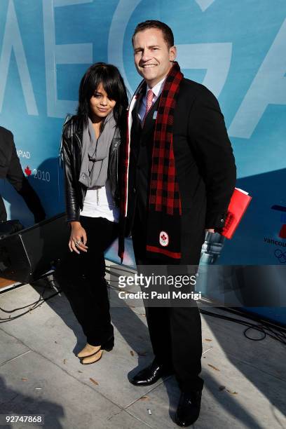 Canadian pop rock star Fefe Dobson and Gregory Swift, Brand President, OMEGA USA, pose for a photo at the unveiling of the OMEGA official countdown...