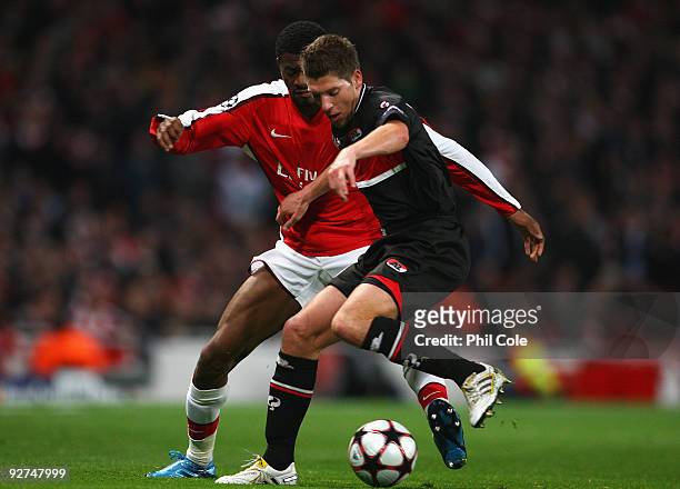 Abou Diaby of Arsenal battles for the ball with Stijn Schaars of AZ Alkmaar during the UEFA Champions League Group H match between Arsenal and AZ...