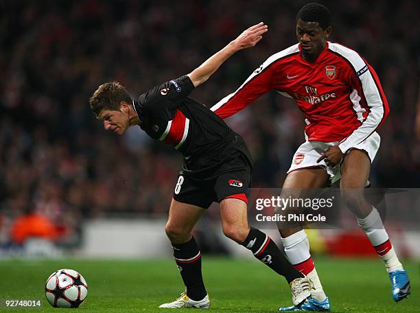Abou Diaby of Arsenal battles for the ball with Stijn Schaars of AZ Alkmaar during the UEFA Champions League Group H match between Arsenal and AZ...