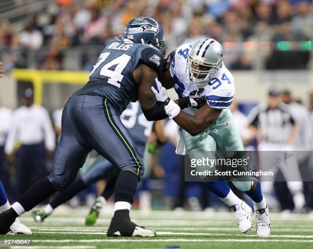 DeMarcus Ware of the Dallas Cowboys rushes the passer against Ray Willis of the Seattle Seahawks at Cowboys Stadium on November 1, 2009 in Arlington,...