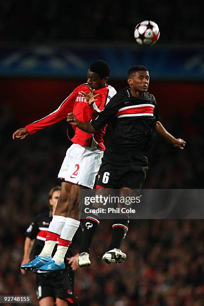 Abou Diaby of Arsenal and David Mendes Da Silva of AZ Alkmaar challenge for the header during the UEFA Champions League Group H match between Arsenal...