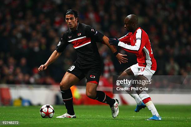 William Gallas of Arsenal chases Graziano Pelle of AZ Alkmaar during the UEFA Champions League Group H match between Arsenal and AZ Alkmaar at the...