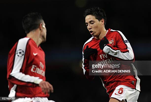 Arsenal's French midfielder Samir Nasri gestures after scoring the second goal against AZ Alkmaar during the Champions League Group H football match...