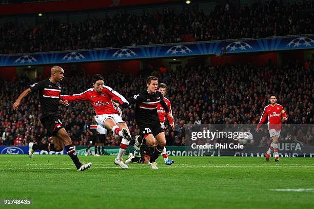 Samir Nasri of Arsenal shoots and scores the second goal of the game during the UEFA Champions League Group H match between Arsenal and AZ Alkmaar at...