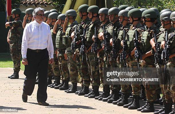Paraguayan President Fernando Lugo reviews troops during a military ceremony in Asuncion on November 4, 2009. Lugo stated that he will stay in power...