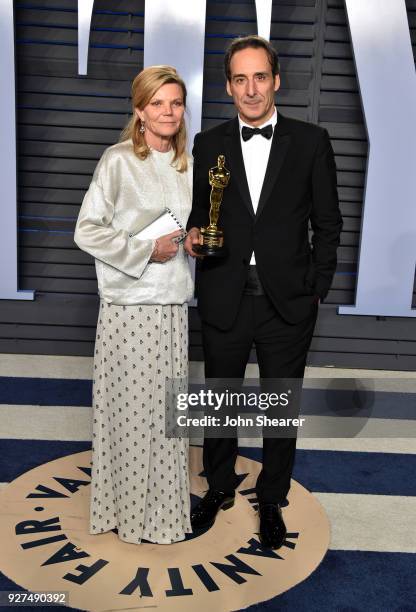 Dominique Lemonnier and Alexandre Desplat attend the 2018 Vanity Fair Oscar Party hosted by Radhika Jones at Wallis Annenberg Center for the...