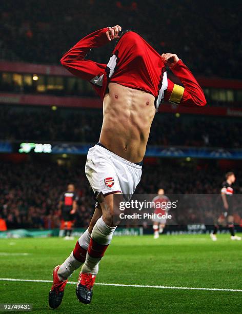 Cesc Fabregas of Arsenal celebrates scoring his second and the third goal of the game during the UEFA Champions League Group H match between Arsenal...