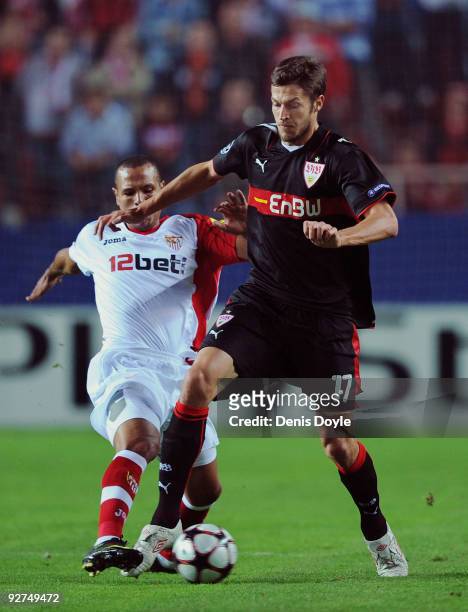 Matthieu Delpierre of VfB Stuttgart is tackled by Luis Fabiano of Sevilla during the UEFA Champions League Group G match between Sevilla and VfB...