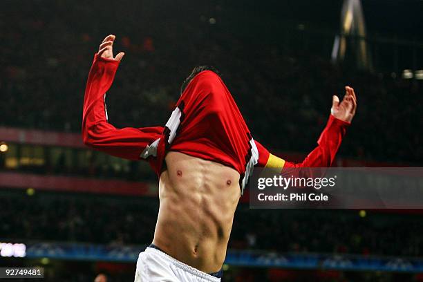 Cesc Fabregas of Arsenal celebrates scoring his second and the third goal of the game during the UEFA Champions League Group H match between Arsenal...