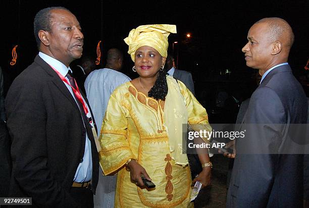 Guinean opposition leaders Alpha Conde , Cellou Daleine Diallo and unionist Hadja Rabiatou Diallo talk after the end of a meeting with Burkina Faso...