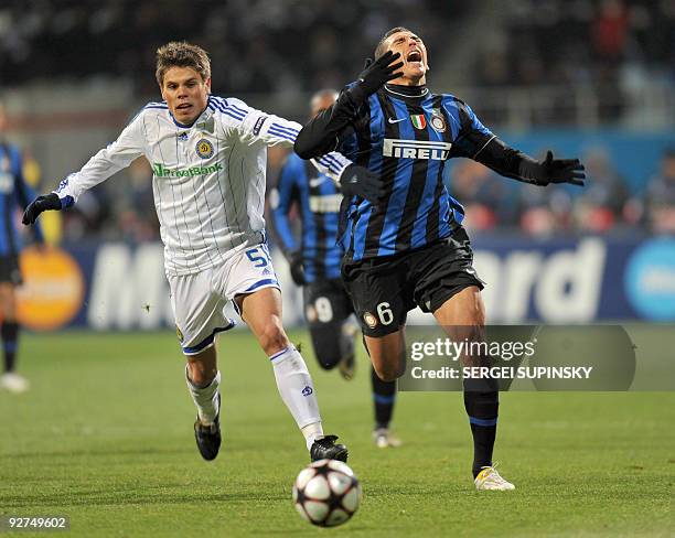 Ognen Vukojevic of FC Dynamo Kiev fights for a ball with Lucio of FC Inter Milan during UEFA Champions League, Group F football match in Kiev on...