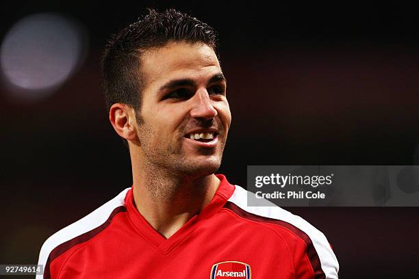 Cesc Fabregas of Arsenal celebrates scoring his second and the teams the third goal of the game during the UEFA Champions League Group H match...