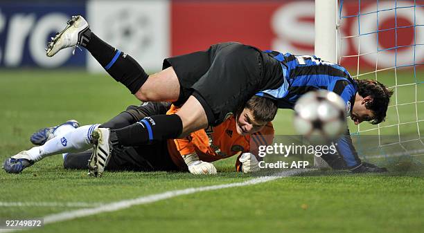 Goalkeeper Stanislav Bogush of FC Dynamo Kiev fights for a ball with Mario Balotelli of Inter Milan during the UEFA Champions League, Group F...