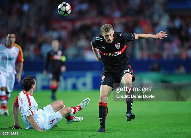 Pavel Pogrebnyak of VfB Stuttgart is tackled by Sebastien Squilaci of Sevilla during the UEFA Champions League Group G match between Sevilla and VfB...