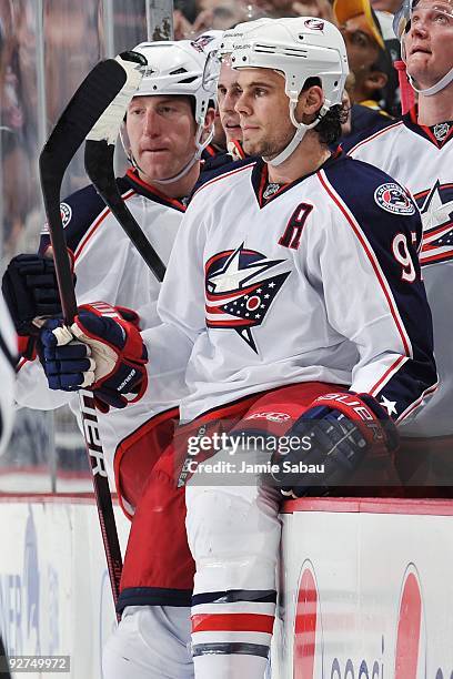 Defensemen Mike Commodore, left, and Rostislav Klesla, right, of the Columbus Blue Jackets take a break during a game against the Pittsburgh Penguins...