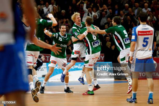 Players of Goeppingen celebrate after scoring the last minute winning goal during the Toyota Handball Bundesliga match between FA Goeppingen and HSV...