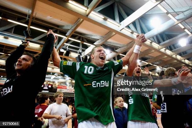 Enid Tahirovic, Lars Kaufmann and Manuel Spaeth of Goeppingen celebrate after winning the Toyota Handball Bundesliga match between FA Goeppingen and...