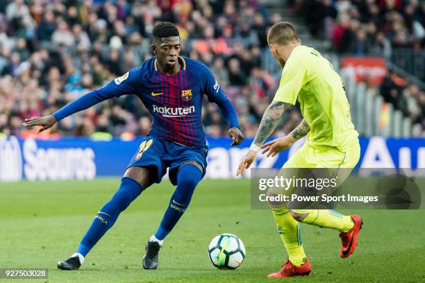 Ousmane Dembele of FC Barcelona fights for the ball with Vitorino Gabriel Pacheco Antunes of Getafe CF during the La Liga 2017-18 match between FC...