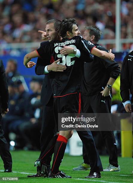 Zdravko Kuzmanovic of VfB Stuttgart celebrates with head coach Markus Babbel after scoring his team's first goal during the UEFA Champions League...