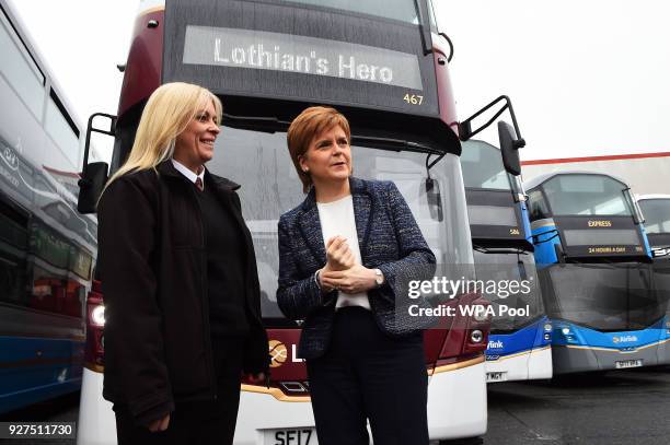 Scotland's First Minister, Nicola Sturgeon meets Charmaine Laurie, a bus driver at the Lothian Bus Central Garage on March 5, 2018 in Edinburgh,...