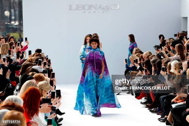 Models present creations for Leonard Paris during the 2018/2019 fall/winter collection fashion show on March 5, 2018 in Paris. / AFP PHOTO / FRANCOIS...