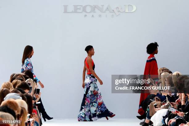 Models present creations for Leonard Paris during the 2018/2019 fall/winter collection fashion show on March 5, 2018 in Paris. / AFP PHOTO / FRANCOIS...