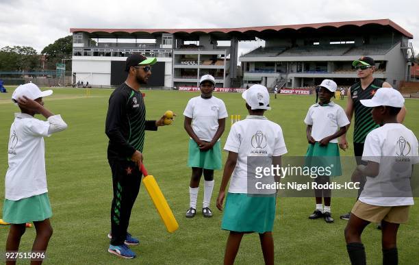 Sikandar Raza Butt of Zimbabwe coaching local school children during a 'Cricket for Good' session at Queens Sports Club on March 5, 2018 in Bulawayo,...