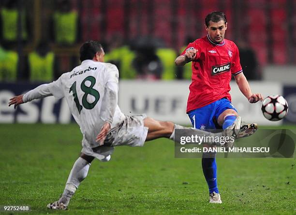 Steven Davis of Rangers FC vies for the ball with Ricardo Vilana of Unirea Urziceni during UEFA Champions League football match in Bucharest, on...