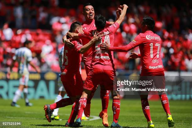 Fernando Uribe of Toluca celebrates with teammates after scoring the first goal of his team during the 10th round match between Toluca and Pachuca as...