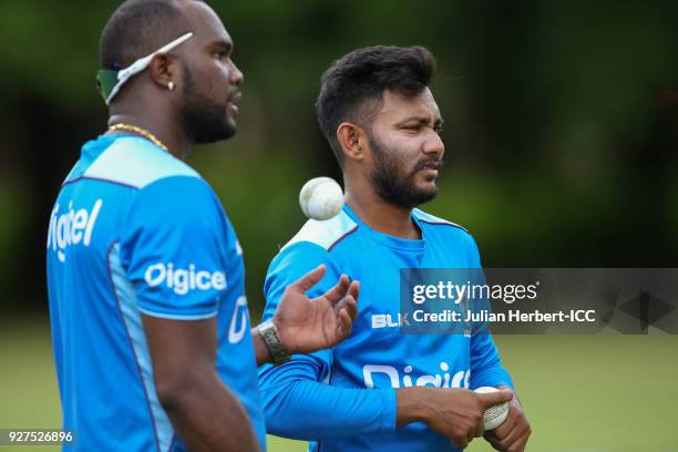 Ashley Nurse and Devendra Bishoo of The West Indies takes part in a training session during The ICC Cricket World Cup at The Old Hararians Sports...