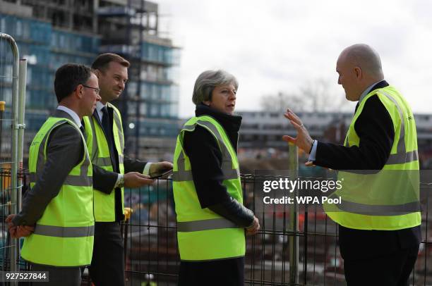 British Prime Minister, Theresa May visits a housing development on March 5, 2018 in East London, England.