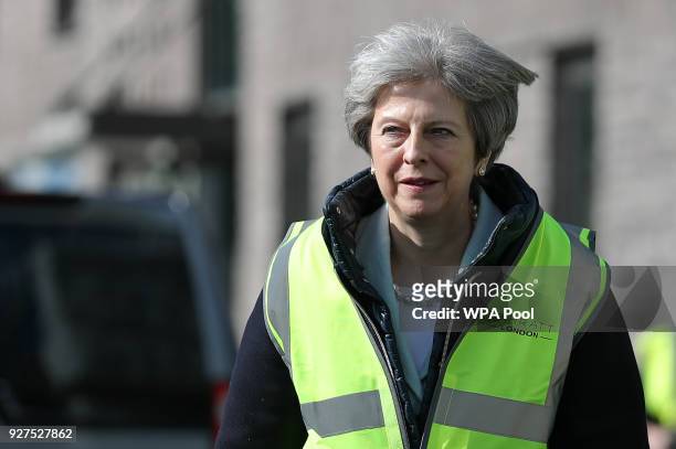 British Prime Minister, Theresa May visits a housing development on March 5, 2018 in East London, England.