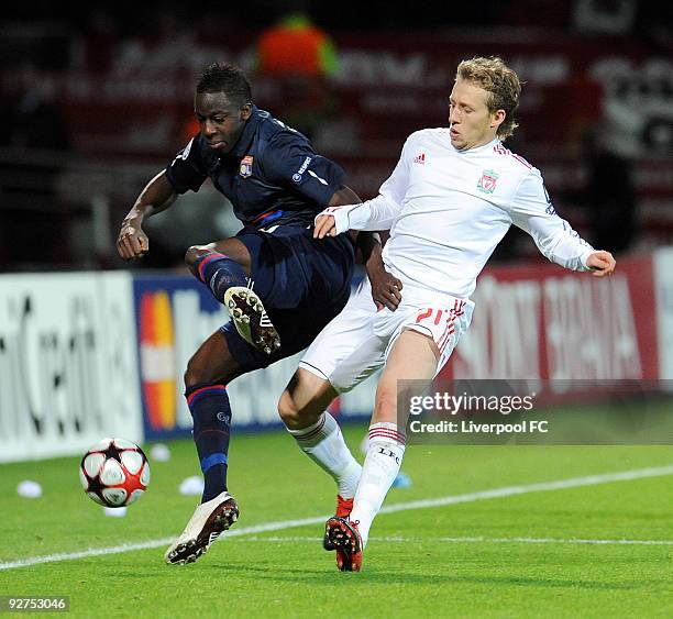Lucas of Liverpool competes with Aly Cissokho of Lyon during the UEFA Champions League Group E match between Liverpool and Lyon at the Stade de...