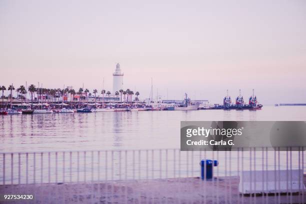 beatiful sunset in the port of malaga - farola stock pictures, royalty-free photos & images