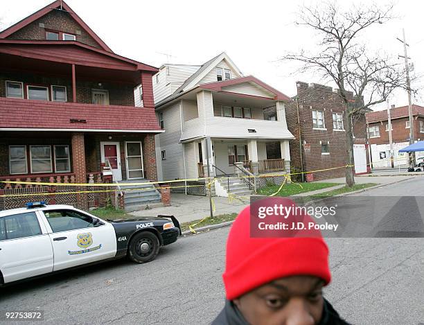 Man stands outside the home of Anthony Sowell November 4 in Cleveland, Ohio. Sowell has been in jail since last week, charged with murder, rape and...