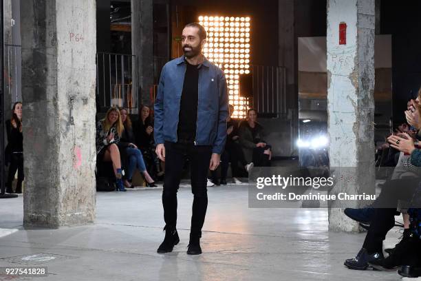 Designer Giambattista Valli acknowledges the applause of the audience after the Giambattista Valli show as part of the Paris Fashion Week Womenswear...