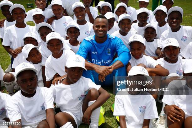 Marlon Samuels of The West Indies cricket team takes part in a Cricket For Good session at The Old Hararians Sports Club on March 5, 2018 in Harare,...