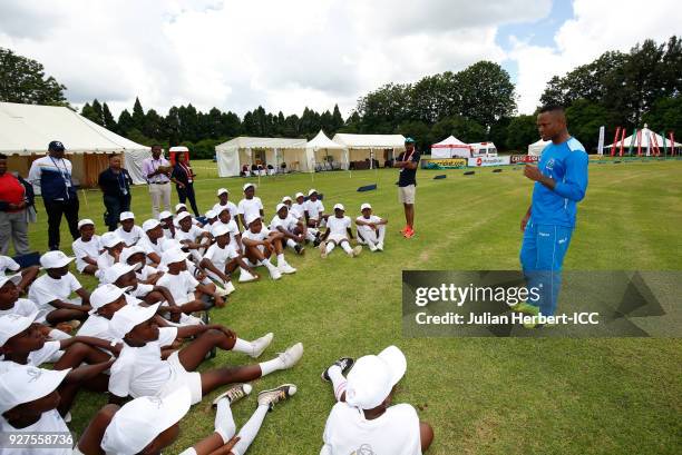 Marlon Samuels of The West Indies cricket team takes part in a Cricket For Good session at The Old Hararians Sports Club on March 5, 2018 in Harare,...