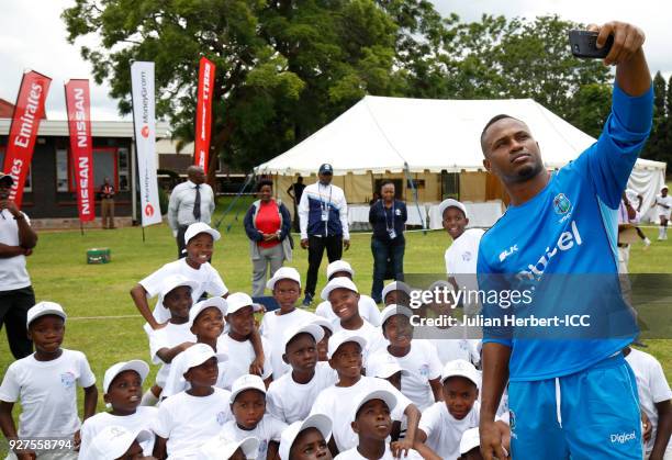 Marlon Samuels of The West Indies cricket team takes part in a Cricket For Good session at The Old Hararians Sports Club on March 5, 2018 in Harare,...