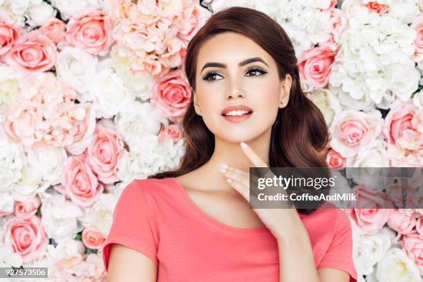 beautiful woman with curly hair - beautiful woman roses stock pictures, royalty-free photos & images
