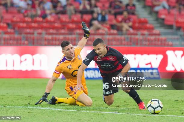 Jaushua Sotirio of the Wanderers taken out of play by Glory's goalkeeper Liam Reddy during the round 23 A-League match between the Western Sydney...