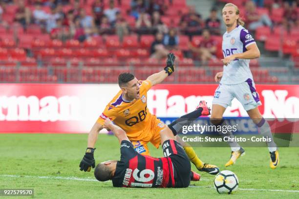 Jaushua Sotirio of the Wanderers taken out of play by Glory's goalkeeper Liam Reddy during the round 23 A-League match between the Western Sydney...