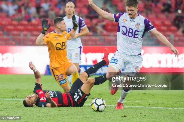 Jaushua Sotirio of the Wanderers taken out of play by Glory's goalkeeper Liam Reddy during the round 23 A-League match between the Western Sydney...