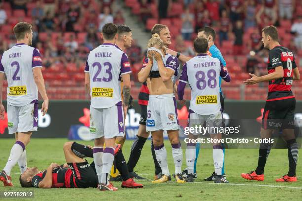 Jaushua Sotirio of the Wanderers lies on the pitch after being tackled by Glory's Liam Reddy during the round 23 A-League match between the Western...